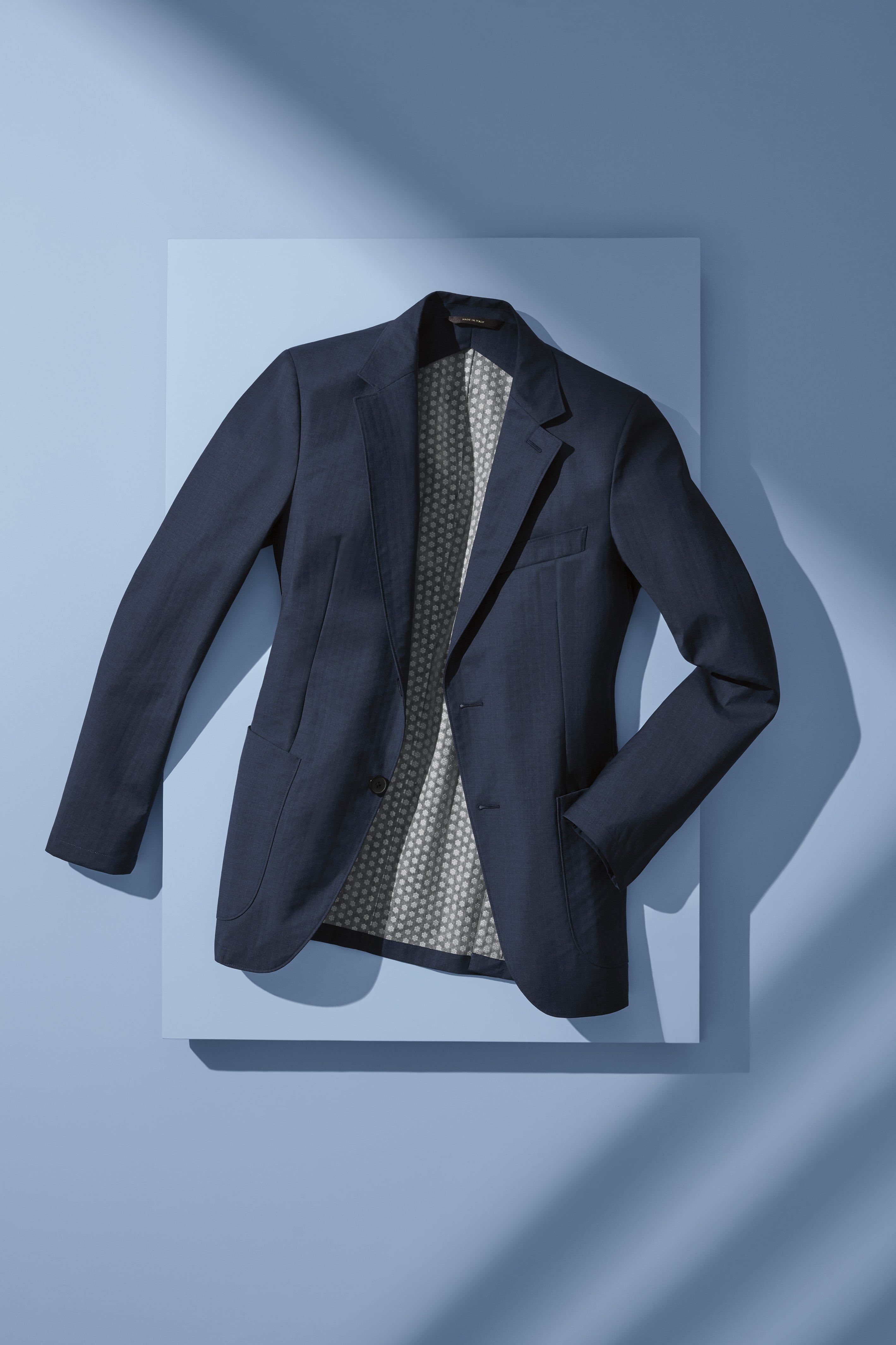 Navy Blue Suit Jacket Flat Lay Product Photography Prompt