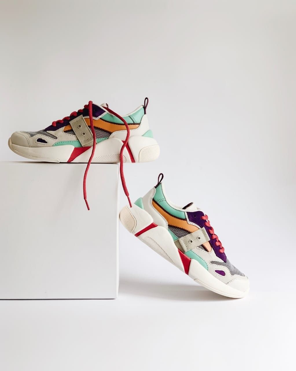 Chunky Multi-Colored Sneakers Product Photography Prompt