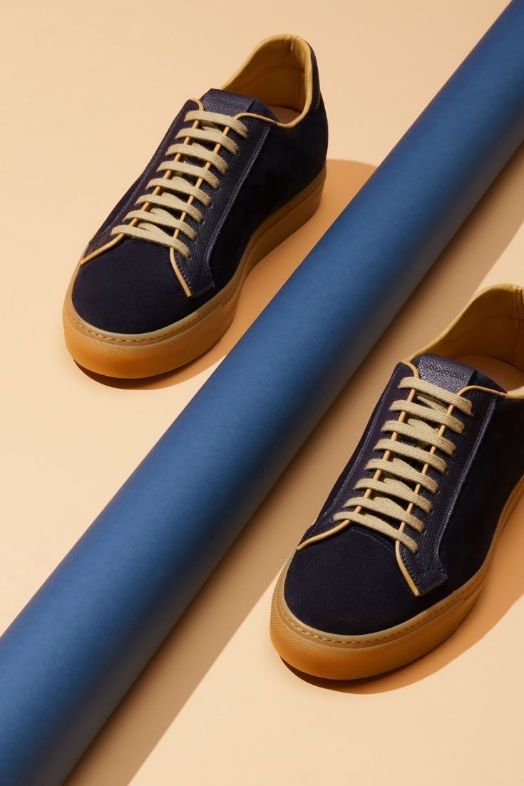 Minimalist Navy Suede Sneaker Product Photography Prompt