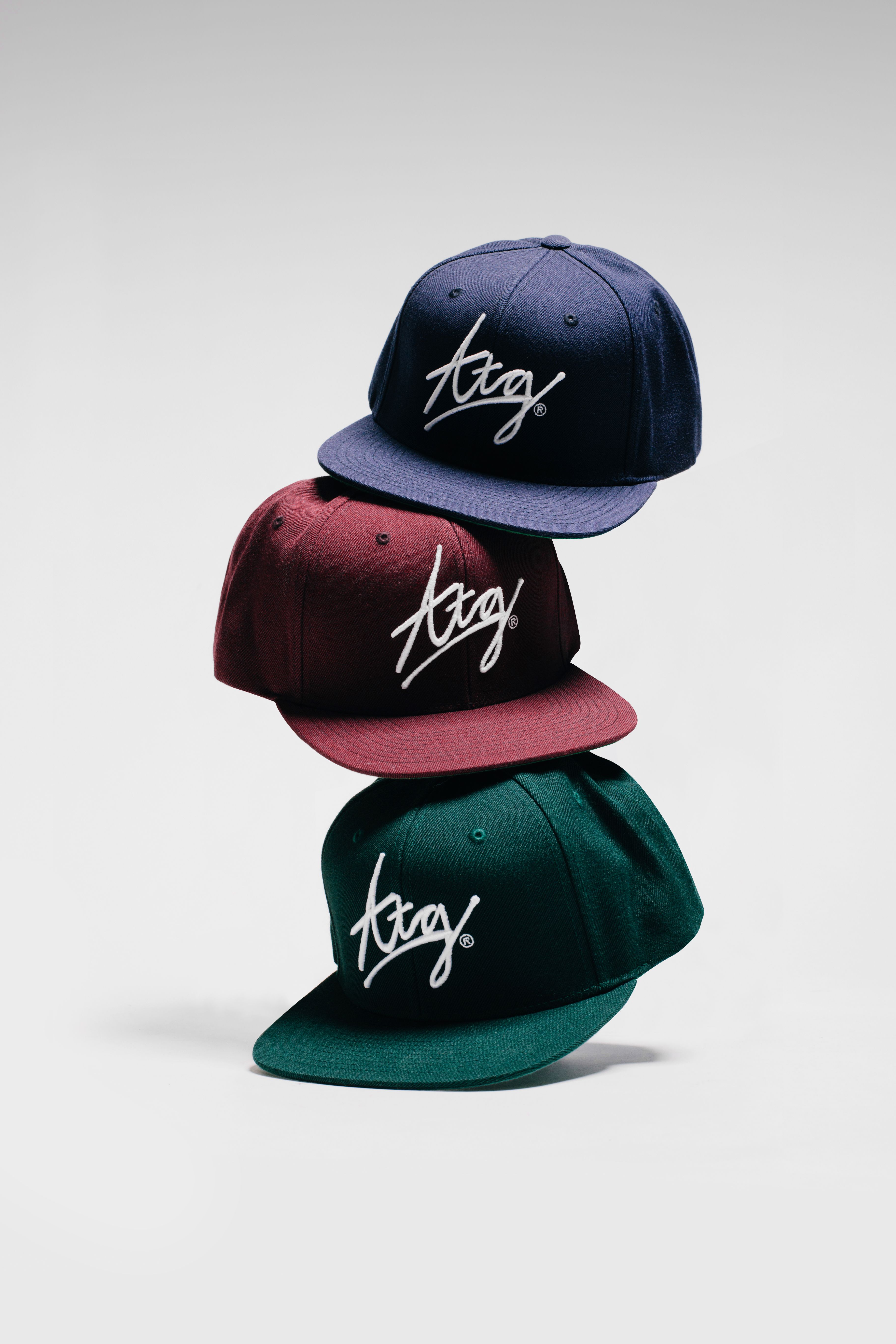 Stacked Snapback Caps Product Photography Prompt