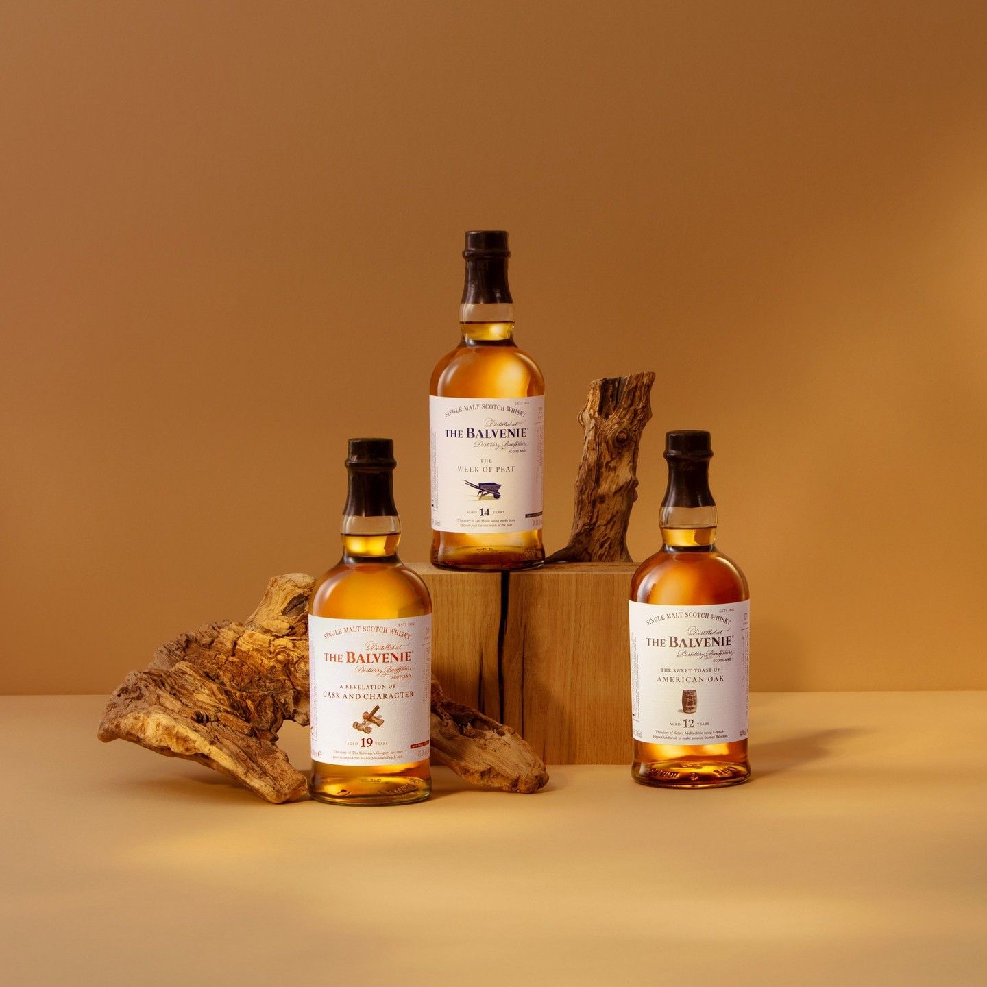 Scotch Whisky Bottle Trio Product Photography Prompt