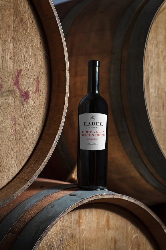 Wine Bottle on Oak Barrels Product Photography Prompt